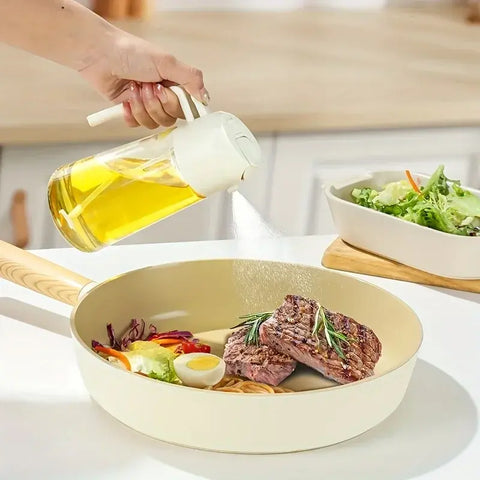 "Kitchen oil spray bottle for even and controlled oil distribution, perfect for cooking with less mess and waste."
