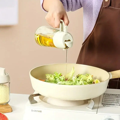 "Kitchen oil spray bottle for even and controlled oil distribution, perfect for cooking with less mess and waste."

