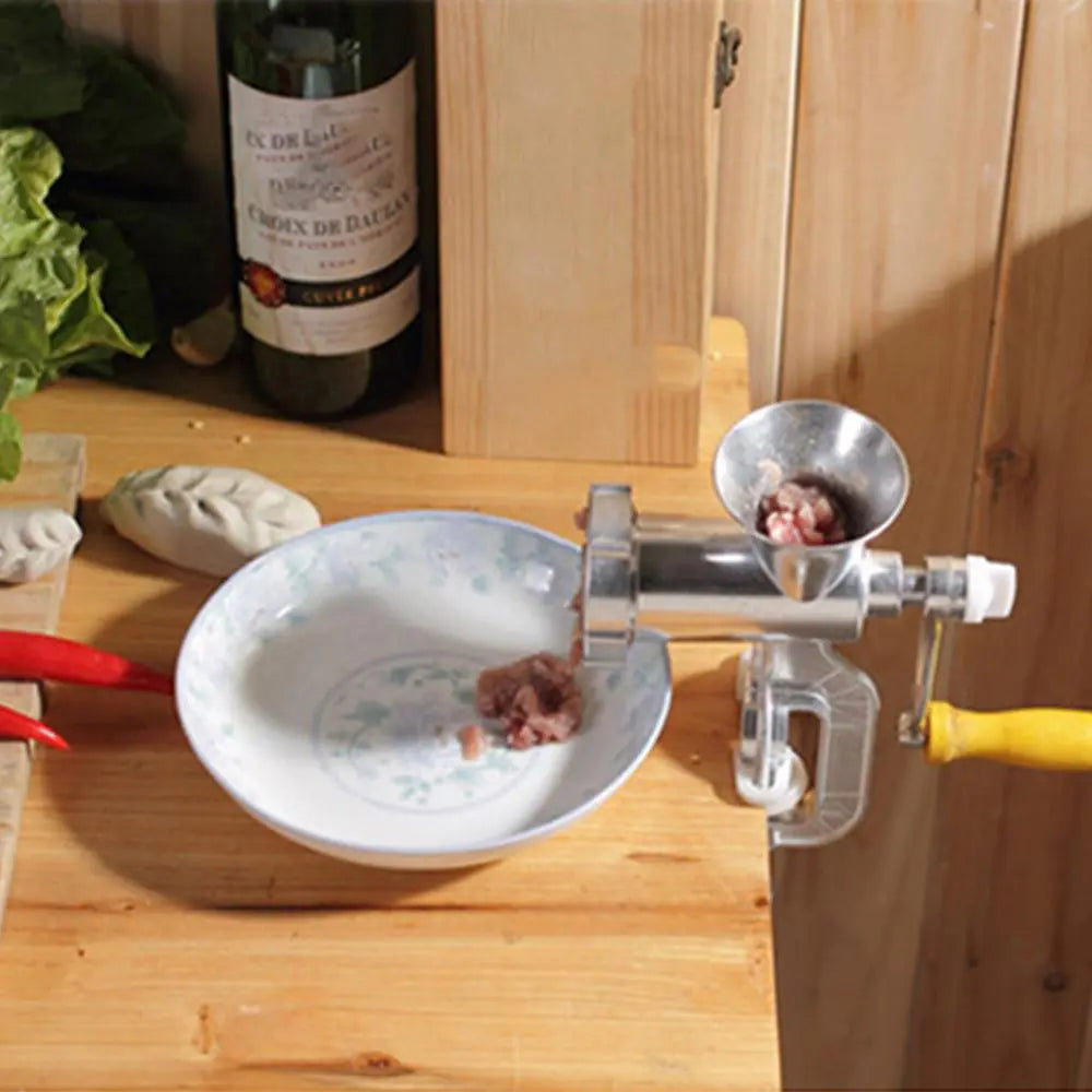 "Multifunctional hand crank meat mincer for grinding fresh meat at home, ideal for sausages, burgers, and more, durable and easy to use."

